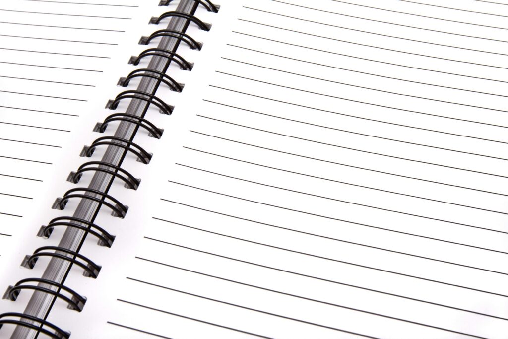 Open spiral notebook with lined pages, perfect for notes and planning.